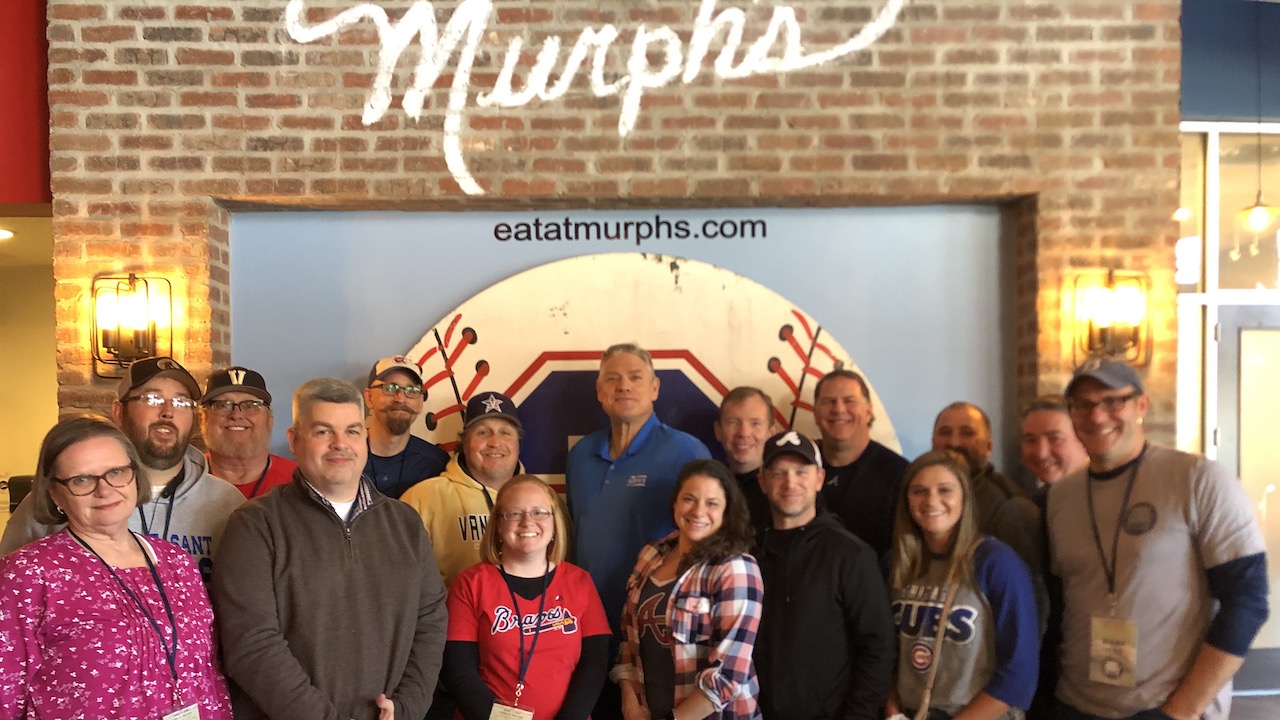 Former Atlanta Braves outfielder Dale Murphy, left, greets other